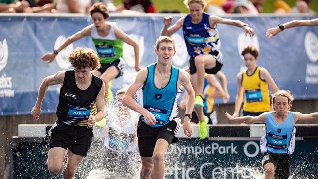 Steeplechase U16 winner Nicholas McGill from Nowra Athletics Club. left.