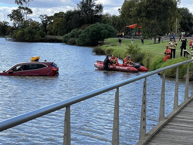 A car has driven straight into a lake in Bendigo this afternoon, with emergency crews led by the SES on scene rescuing those inside. Picture: Gianni Francis