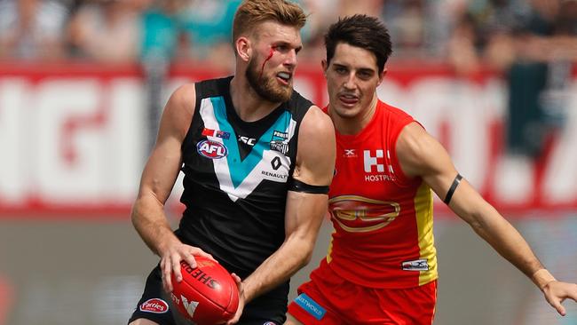 BLEEDING TEAL ... Port Adelaide utility Jackson Trengove is a restricted free agent who will draw much interest in the market this year, but may want to ignore big offers to stay with the Power. Picture: Michael Willson (Getty Images)