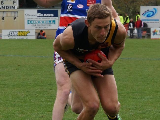 Woori Yallock’s Ben Monkhorst marks the ball.