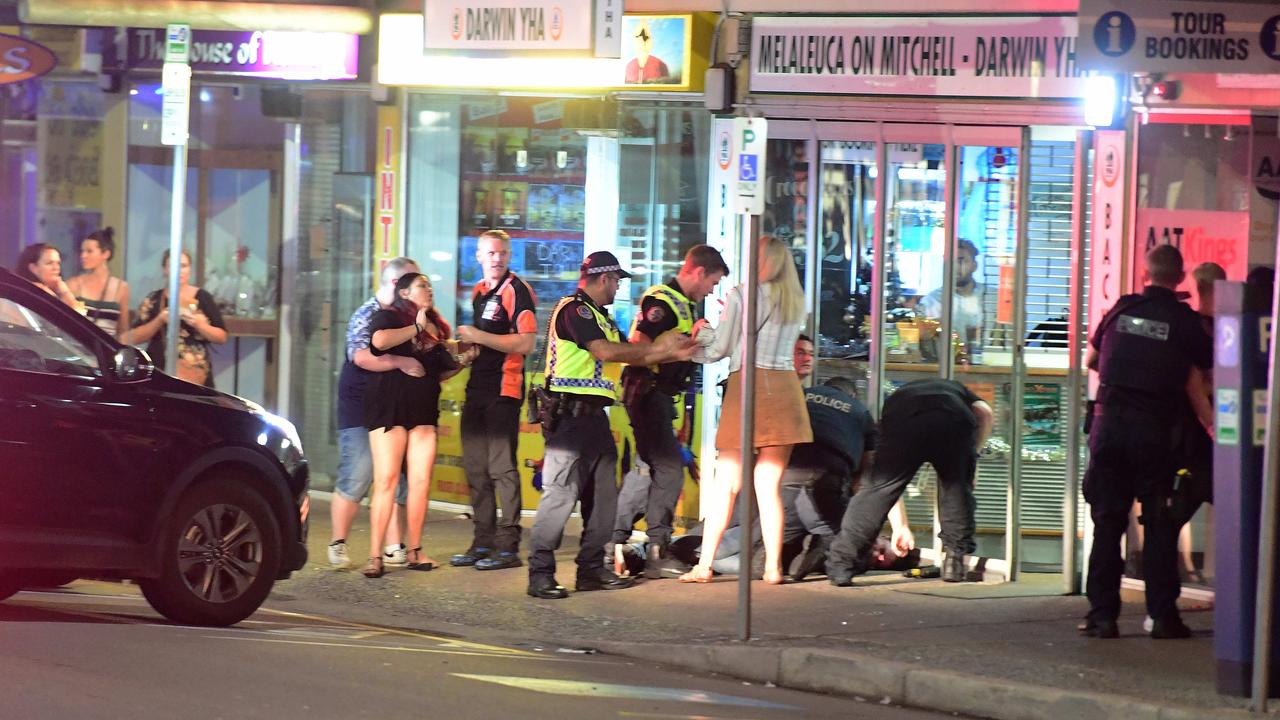 Police officers break up a fight on Mitchell street in the early hours of New Year's day