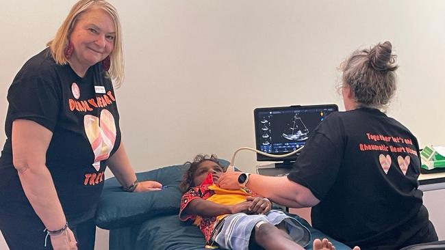 Deadly Hearts co-chair Vicki Wade with Royal Darwin Hospital's Dr Hilary Hardefeldt performing an echocardiogram at Yipirinya School as part of the Deadly Heart Trek 2024 Central Australia leg. Picture: Supplied