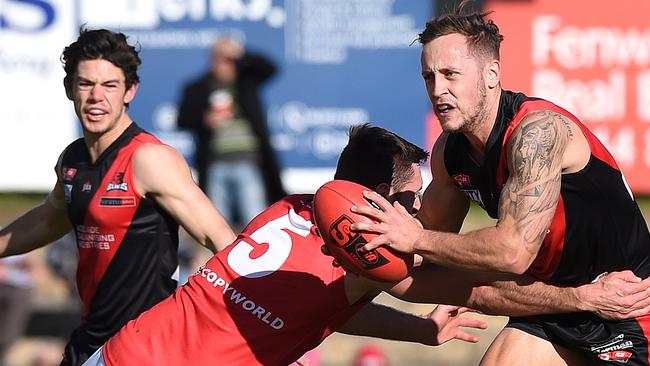 West’s Taite Silverlock breaks through a tackle against North Adelaide. Picture: Roger Wyman