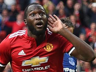 Manchester United's Belgian striker Romelu Lukaku (C) celebrates after scoring their third goal during the English Premier League football match between Manchester United and Everton at Old Trafford in Manchester, north west England, on September 17, 2017. / AFP PHOTO / Oli SCARFF / RESTRICTED TO EDITORIAL USE. No use with unauthorized audio, video, data, fixture lists, club/league logos or 'live' services. Online in-match use limited to 75 images, no video emulation. No use in betting, games or single club/league/player publications.  /