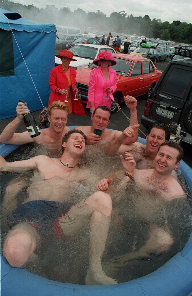 Adrian rossetto, Jason Graham, David Berry and George Kyritsis enjoy a spa in the carpark at Flemington in 1997.