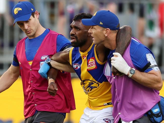 PERTH, AUSTRALIA - APRIL 02: Liam Ryan of the Eagles is assisted off the field during the 2023 AFL Round 03 match between the Fremantle Dockers and the West Coast Eagles at Optus Stadium on April 2, 2023 in Perth, Australia. (Photo by Will Russell/AFL Photos via Getty Images)