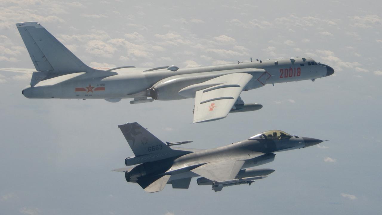 A Taiwanese F-16 fighter jet flying next to a Chinese H-6 bomber off the coast of Taiwan. Picture: Taiwan's Defence Ministry/AFP