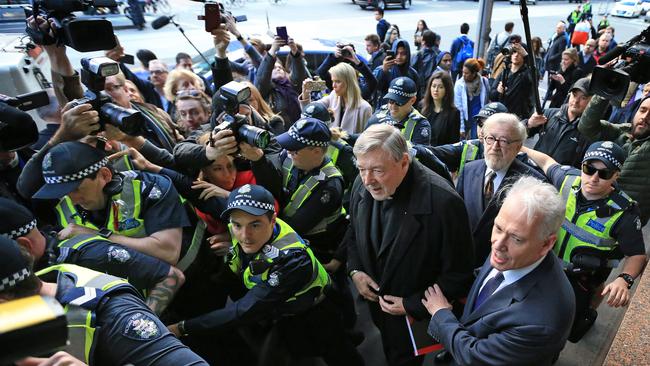 The media scrum surrounding Cardinal George Pell as he arrived at Melbourne Magistrates Court in July 2017 for a filing hearing on historical sexual assault charges was the biggest <i>Herald Sun</i> photographer Mark Stewart had ever seen, and marked the start of one of the biggest chapters in the history of the Catholic Church in Australia. To get a clear view of the Pell, Stewart “took a gamble” and raced ahead of the pack to an elevated position, where he could “shoot down” and see Pell’s face.