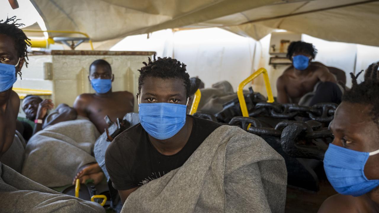 Migrants were helped off the rescue ship funded by British street artist Banksy <i>Louise Michel</i> sit covered with blankets on board the civil sea rescue ship <i>Sea-Watch 4</i> off the coast of Malta, on August 29, 2020. Picture: Thomas Lohnes / AFP