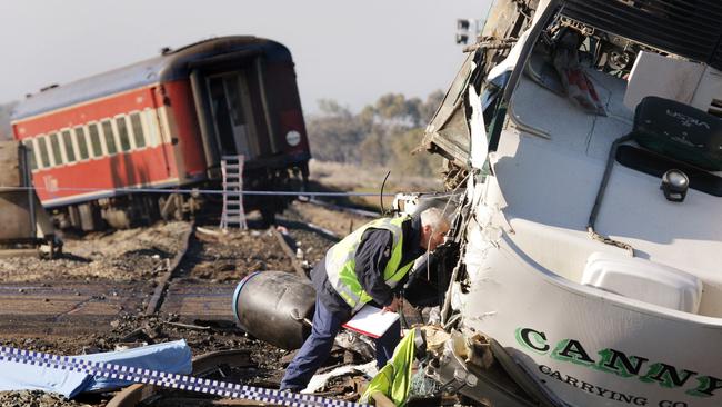 A fully-laden truck lies beside the rail track a day after it slammed into the V/Line train at Kerang.