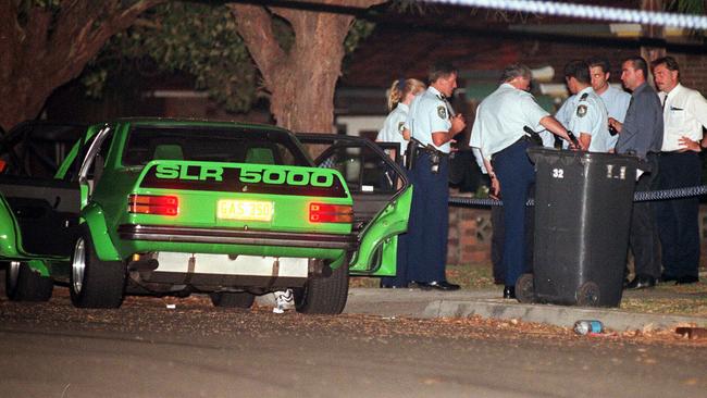 Police at the scene of the execution-style murder of bouncer and concreter Tim Voukelatos