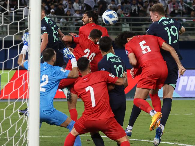 Australia's Harry Souttar (R) scores a goal during the 2026 FIFA World Cup AFC qualifiers football match between Palestine and Australia at Jaber Al-Ahmad International Stadium in Kuwait City on November 21, 2023. (Photo by Yasser Al-Zayyat / AFP)