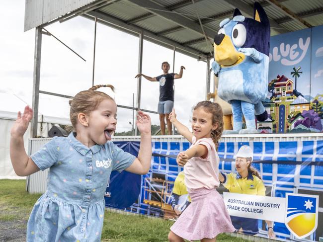 (from left) Bella McGrath and Phoebe Evans dance during the Bluey show at the Toowoomba Royal Show. Saturday, March 26, 2022. Picture: Nev Madsen.