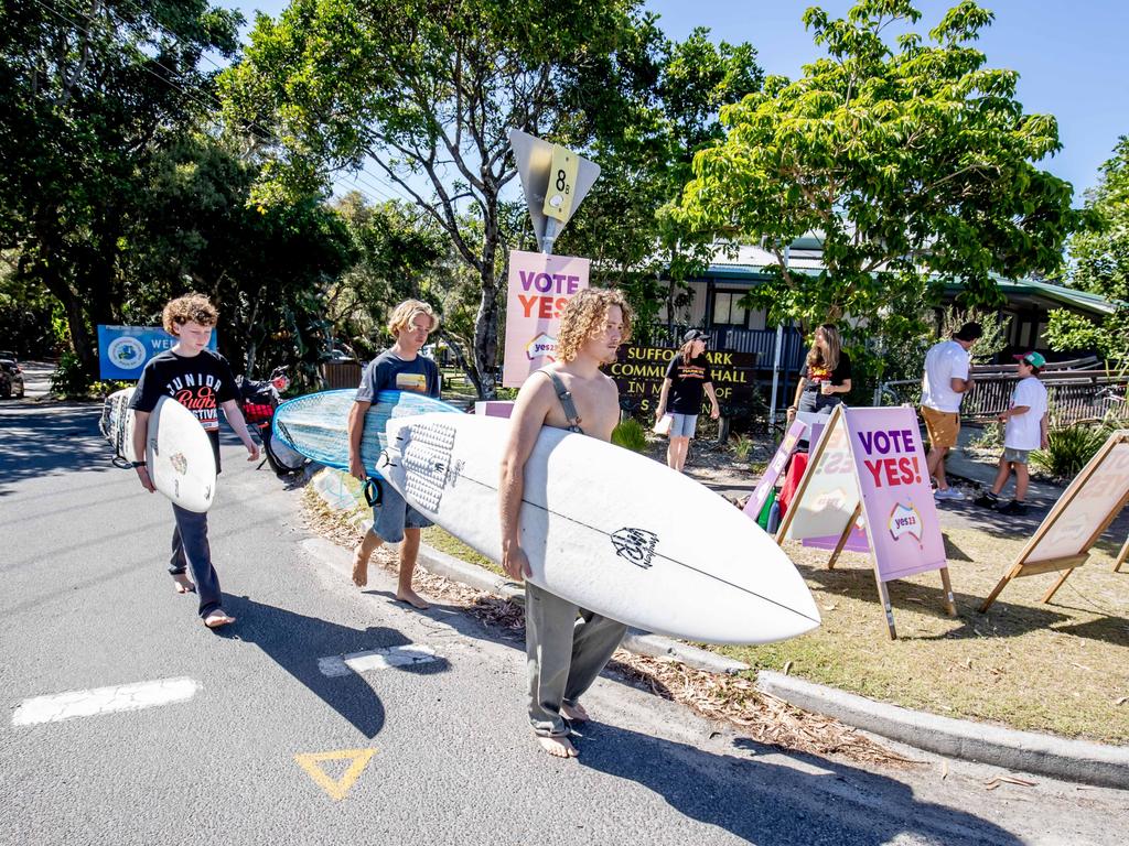 Oscar Triggs, right, votes during the Referendum on The Voice at Suffolk Park Community Hall polling station, in Byron Bay, NSW. Pictured with Arlo Stack, 13, and Jet Adams, 14. Picture: Luke Marsden