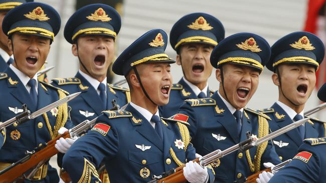 Military troops march during a welcoming ceremony for US President Donald Trump in Beijing in 2017.