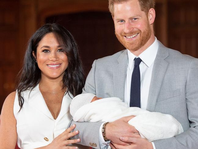 (FILES) In this file photo taken on May 08, 2019 Britain's Prince Harry, Duke of Sussex (R), and his wife Meghan, Duchess of Sussex, pose for a photo with their newborn baby son, Archie Harrison Mountbatten-Windsor, in St George's Hall at Windsor Castle. - Prince Harry and his wife Meghan's new home in Windsor cost £2.4 million ($3.05 million, 2.7 million euros) of taxpayers' money to renovate, royal accounts showed on June 25, 2019, prompting criticism from anti-monarchy campaigners. (Photo by Dominic Lipinski / POOL / AFP)