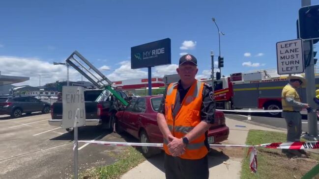 Firefighters attend a single vehicle car crash in Cairns