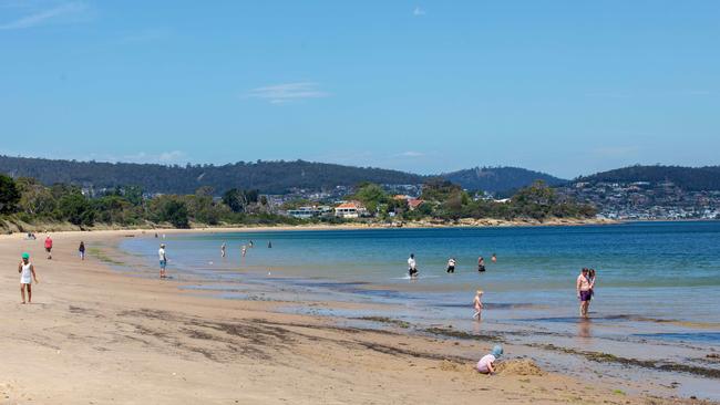 Beachgoers at Bellerive Beach on the hottest dat of summer so far. Picture: Linda Higginson