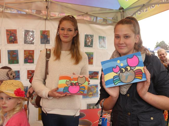 Renee Wright and Bella Winters show off their creations made at the Sand Wizard stall at the Jumpers and Jazz markets at Leslie Park on Sunday, July 26. Photo Deanna Millard / Daily News