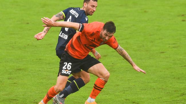 Jay O'Shea of the Roar gets past Francesco Margiotta of the Victory during the A-League Mens match between Brisbane Roar and Melbourne Victory at Moreton Daily Stadium, on April 25, 2022, in Brisbane, Australia. (Photo by Albert Perez/Getty Images)