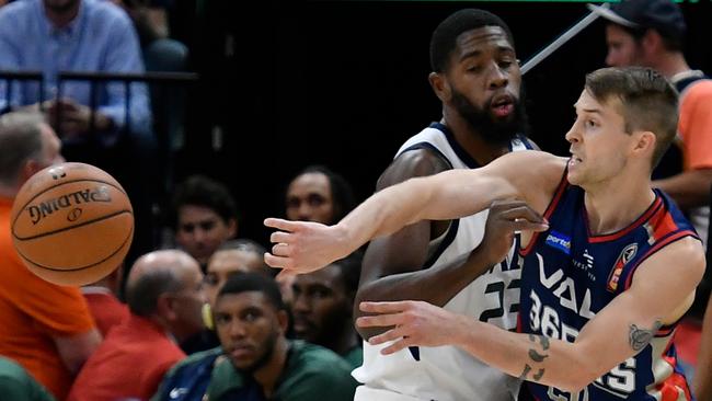 Nathan Sobey #20 of the Adelaide 36ers passes around the defence of Royce O'Neale #23 of the Utah Jazz. Picture: Getty Images