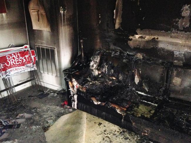 A burned couch is shown next to warped campaign signs at the Orange County Republican Headquarters in Hillsborough, NC. Picture: AP