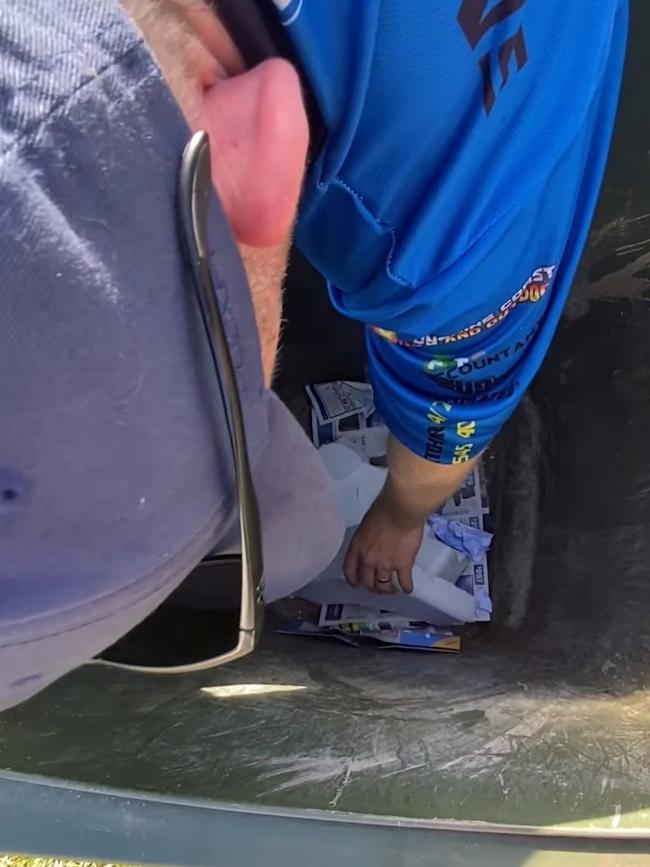 A Sunshine Coast snake catcher has shared footage of removing a red bellied black snake from a suburban rubbish bin. Picture: Facebook