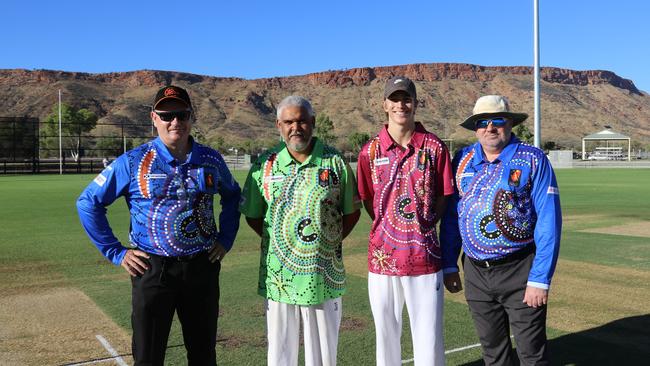 Umpires Stuart Blanch, left, and Brendan Muldoon with Top End Thunder captain Andrew Kelly (green) and Tennant Creek Captain Lachlan Dunemann. Picture: Cricket NT