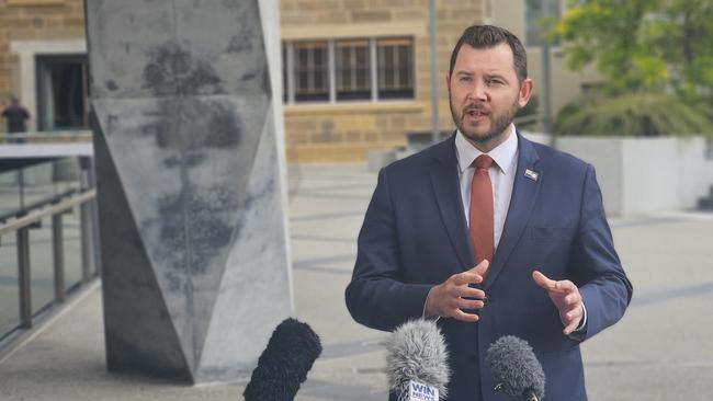 : Liberal minister Felix Ellis speaks to the media at Parliament Square.