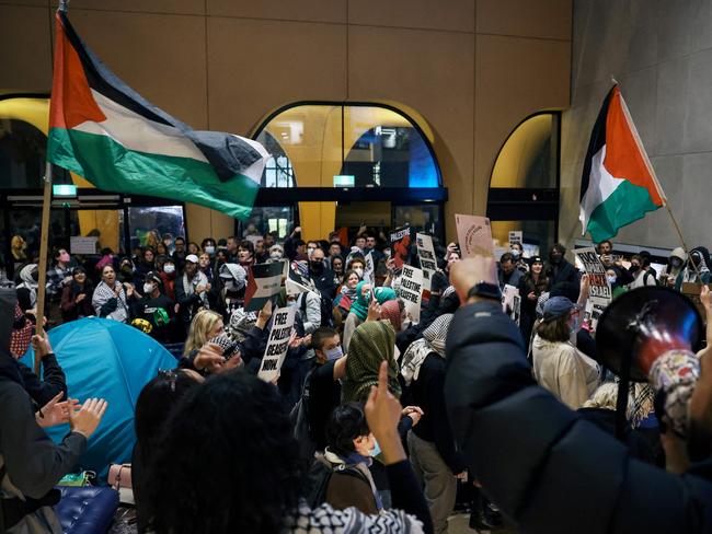 Pro-Palestinian students hold a sit-in in Melbourne on May 15, 2024 at Melbourne University's Arts West building, which the students have temporarily renamed as "Mahmoud's Hall" after Mahmoud Al Haq, a prospective University of Melbourne student, who died in Gaza. (Photo by Martin KEEP / AFP)