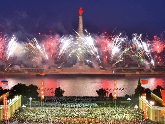 North Koreans celebrate in Pyongyang following what the country claims was a successful test of a hydrogen bomb. Picture: KNCA/AFP