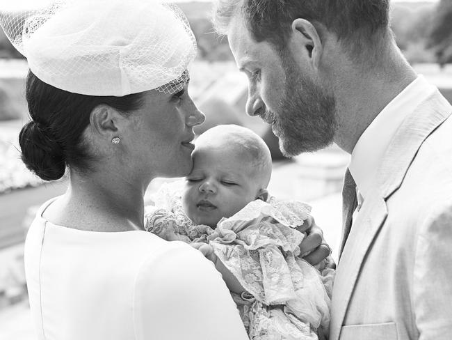 TOPSHOT - This official handout Christening photograph released by the Duke and Duchess of Sussex shows Britain's Prince Harry, Duke of Sussex (R), and his wife Meghan, Duchess of Sussex holding their baby son, Archie Harrison Mountbatten-Windsor at Windsor Castle with the Rose Garden in the background, west of London on July 6, 2019. - Prince Harry and his wife Meghan had their baby son Archie christened on Saturday at a private ceremony. (Photo by Chris ALLERTON / SUSSEXROYAL / AFP) / XGTY / RESTRICTED TO EDITORIAL USE - MANDATORY CREDIT "AFP PHOTO / SUSSEXROYAL / CHRIS ALLERTON" - NO MARKETING NO ADVERTISING CAMPAIGNS - NO COMMERCIAL USE - NO THIRD PARTY SALES - RESTRICTED TO SUBSCRIPTION USE - NO CROPPING OR MODIFICATION - NOT FOR USE AFTER DECEMBER 31, 2019 - DISTRIBUTED AS A SERVICE TO CLIENTS /