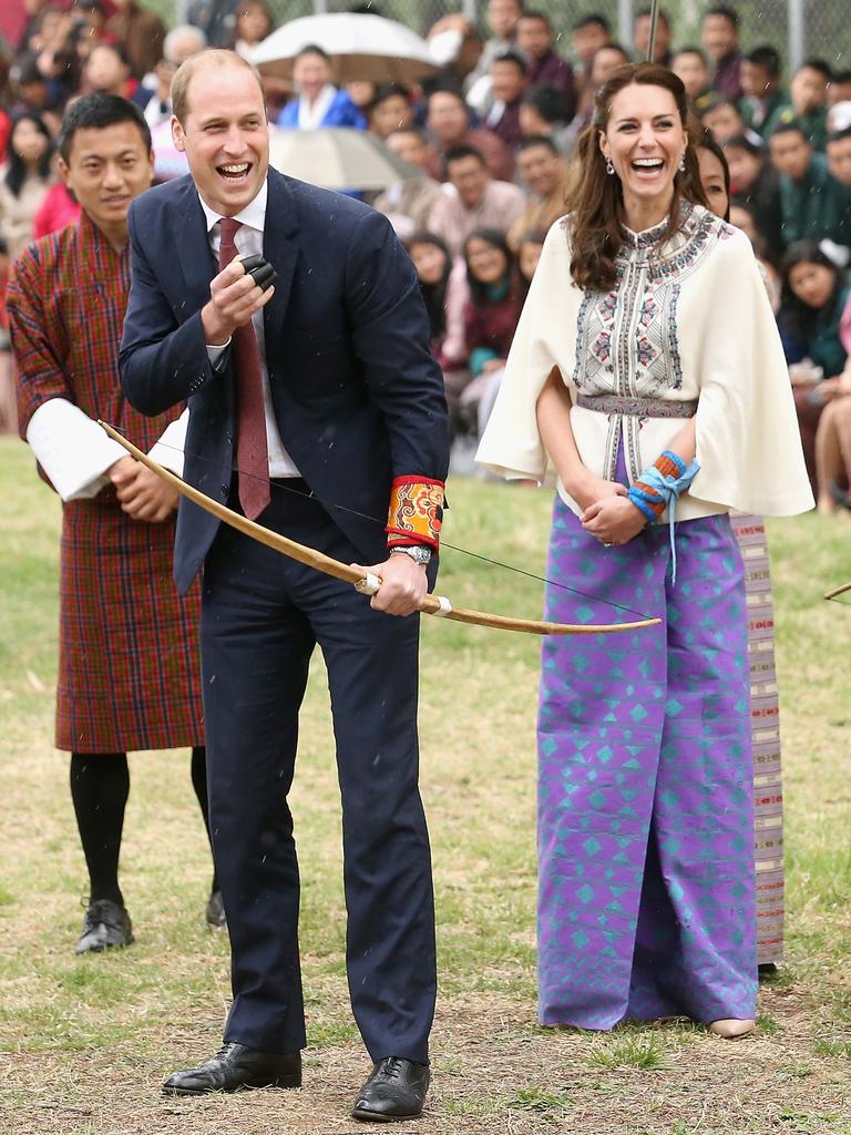 Prince William, Duke of Cambridge fires an arrow as Catherine, Duchess of Cambridge looks on during an Bhutanese archery demonstration on the first day of a two day visit to Bhutan on the 14th April 2016 in Paro, Bhutan. Picture: Getty