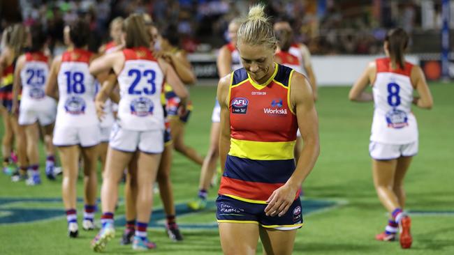 Erin Phillips walks off after the Crows lost their first match of the season.