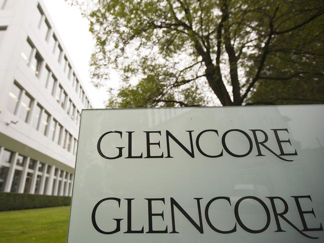 The logo of Glencore is seen in front of the company's headquarters in the Swiss town of Baar in this September 7, 2012 file photo. Concern about U.S. monetary policy and slowdown in emerging markets led by China has hit commodities markets and related stocks like Glencore last week and ramped up volatility. REUTERS/Michael Buholzer/Files GLOBAL BUSINESS WEEK AHEAD PACKAGE - SEARCH "BUSINESS WEEK AHEAD OCTOBER 5" FOR ALL 29 IMAGES