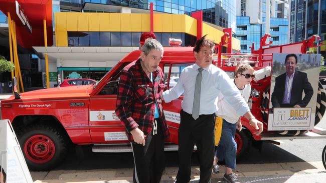 Mayoral candidate Brett Lambert offered a lift to some elderly resident. Picture Glenn Hampson