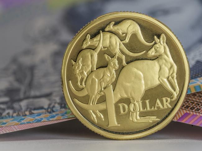 Australian $1 coin and notes close-up, investing, generic