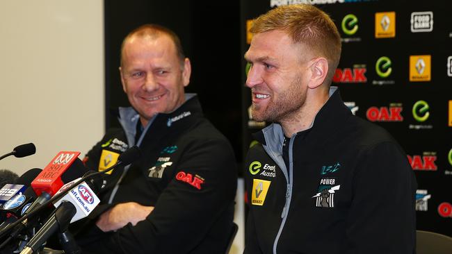 Ken Hinkley at a press conference with Kane Cornes as he announces he will retire after his 300th game. Picture: Sarah Reed