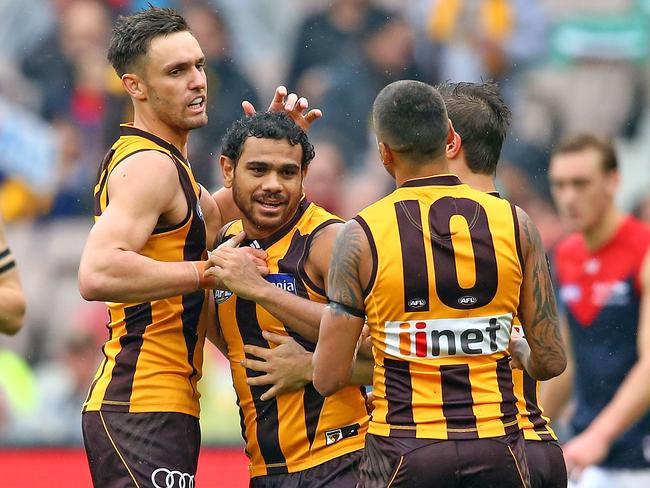 Cyril Rioli is mobbed by teammates after a goal. Picture: Getty Images