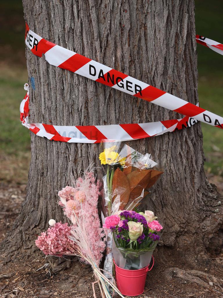 Flowers at the scene of the accident at Holland Park. Picture: Liam Kidston