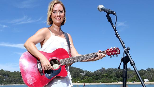 Brooke Supple with the guitar, now stolen. Photo by Richard Gosling