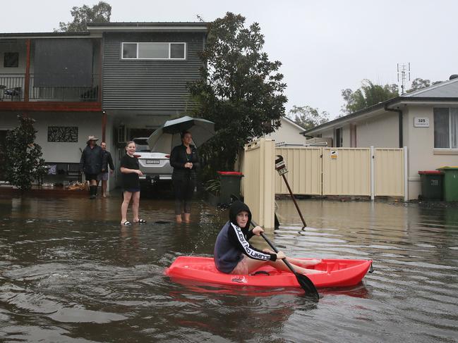 Tuggerawong residents outside their home. Picture: Sue Graham