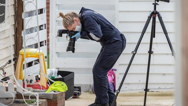 Police search the Blackburn North home for clues. Picture: Jason Edwards