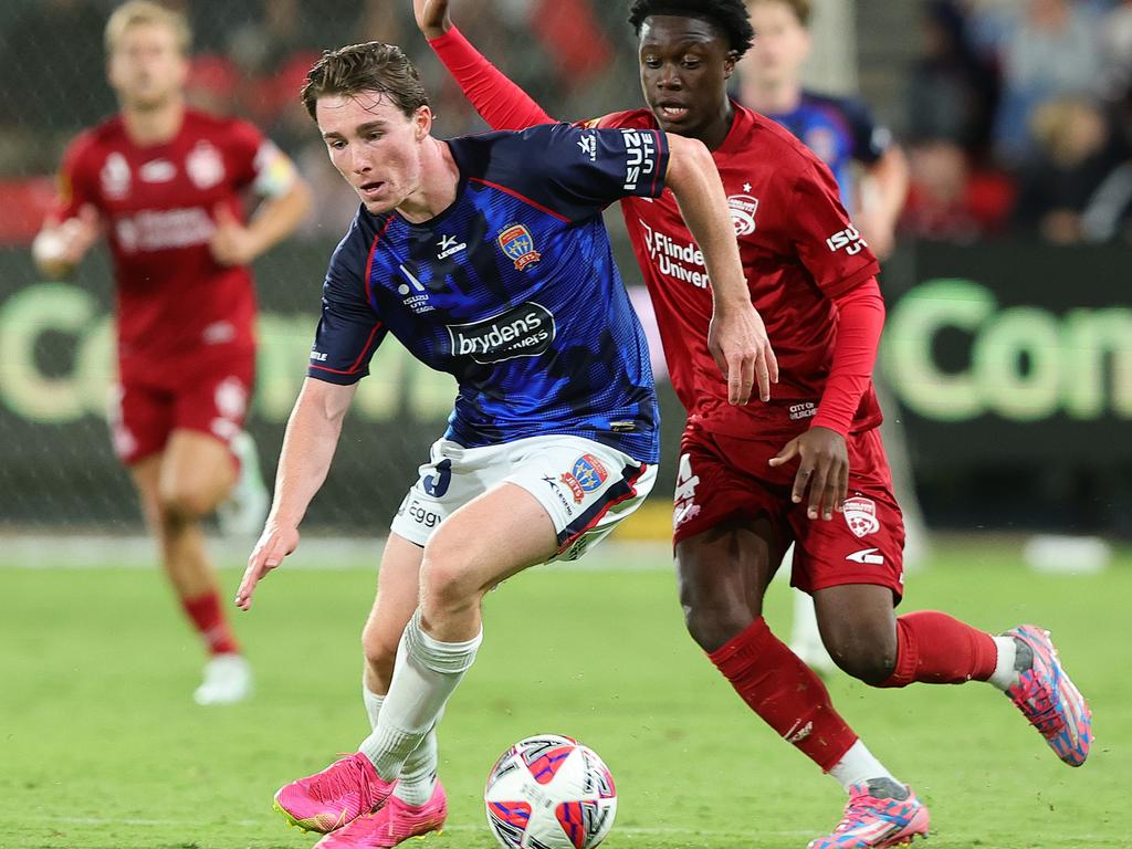 ADELAIDE, AUSTRALIA - FEBRUARY 15: Clayton Taylor of Newcastle Jets and Amiani Tatu of Adelaide United during the round 19 A-League Men match between Adelaide United and Newcastle Jets at Coopers Stadium, on February 15, 2025, in Adelaide, Australia. (Photo by Sarah Reed/Getty Images)