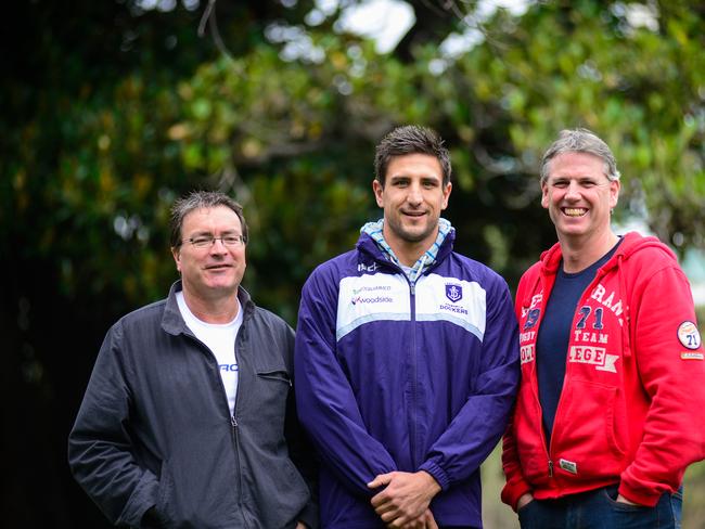 Fremantle footballer Matthew Pavlich catches up with his former school coaches Sean Hill (red) and Anthony Goodrich. Goodrich coached Pavlich at Sacred Heart.