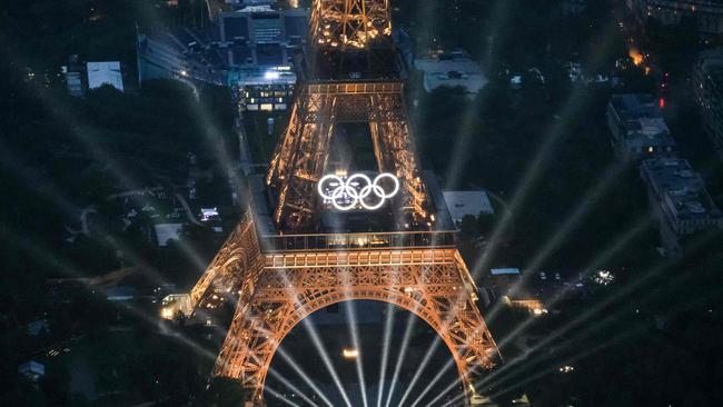 The Eiffel Tower and Olympics Rings lit up during the opening ceremony of the Paris 2024 Olympics. A report has been tabled into key learnings by a council delegation to the Games. Picture: Lionel Bonaventure/AFP