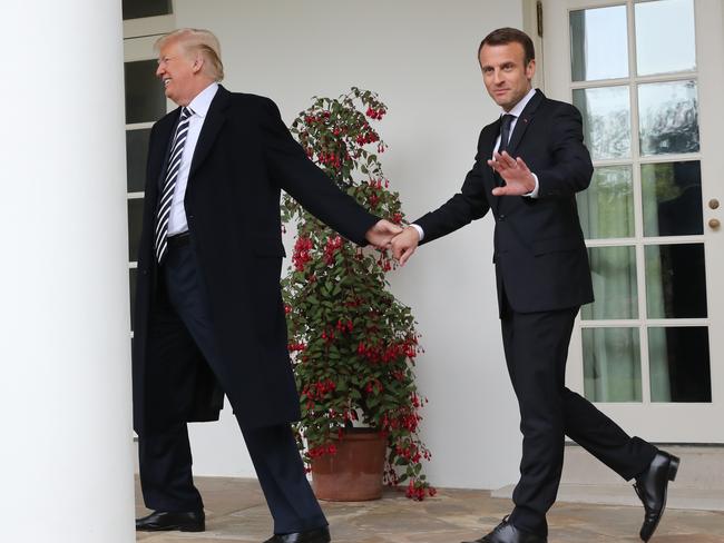 Donald Trump had more luck taking the hand of French President Emmanuel Macron at the White House. Picture: AP Photo/Pablo Martinez Monsivais