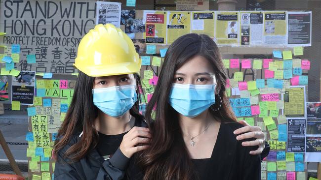 UQ students from Hong Kong who have been involved in the Lennon's Wall protest at UQ in solidarity with their countrymen back at home. Picture:: Liam Kidston