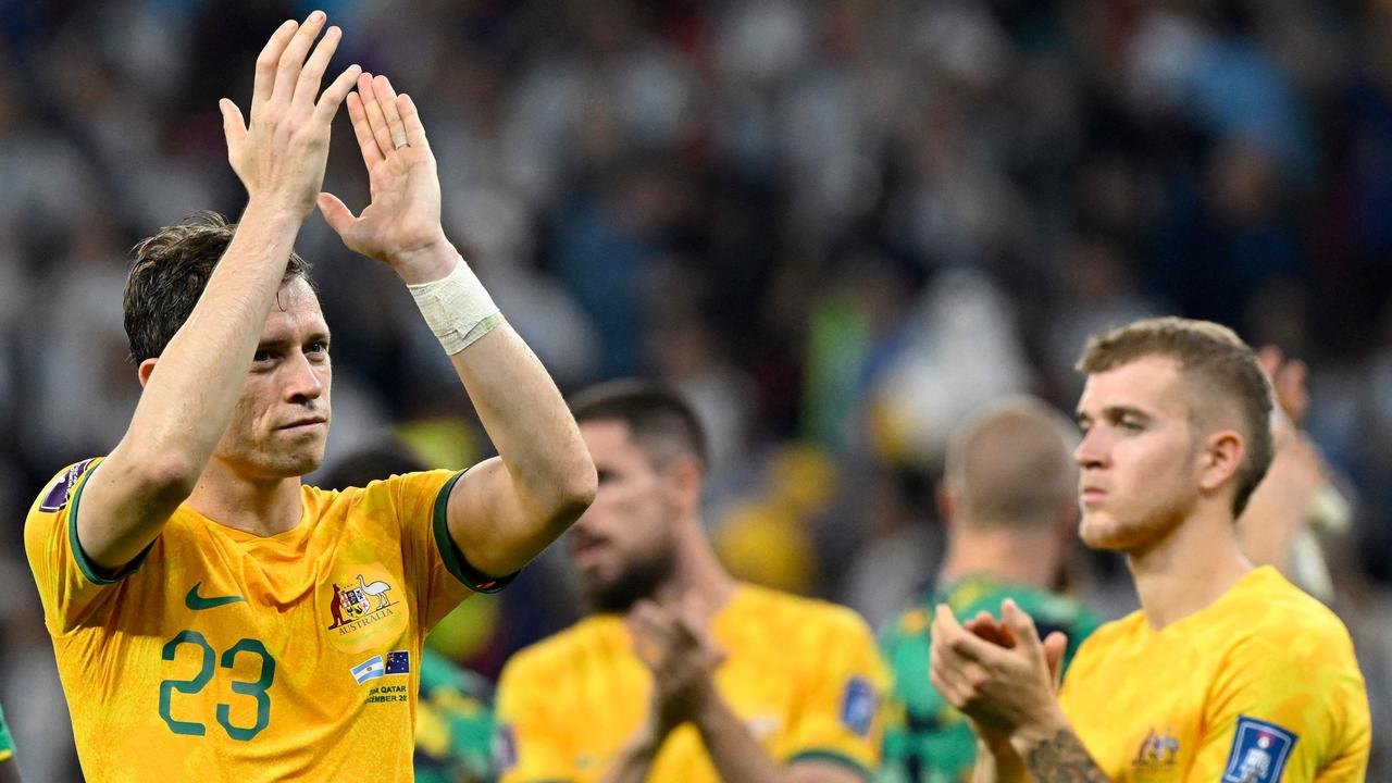 Craig Goodwin (left) thanks fans of the Socceroos after Australia’s World Cup loss to Argentina. Picture: Alfredo ESTRELLA / AFP