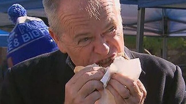 Bill Shorten chomping into a democracy sausage. Picture: Nine News